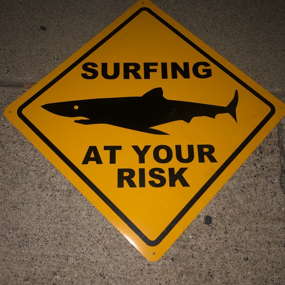 Surf at your own risk sign